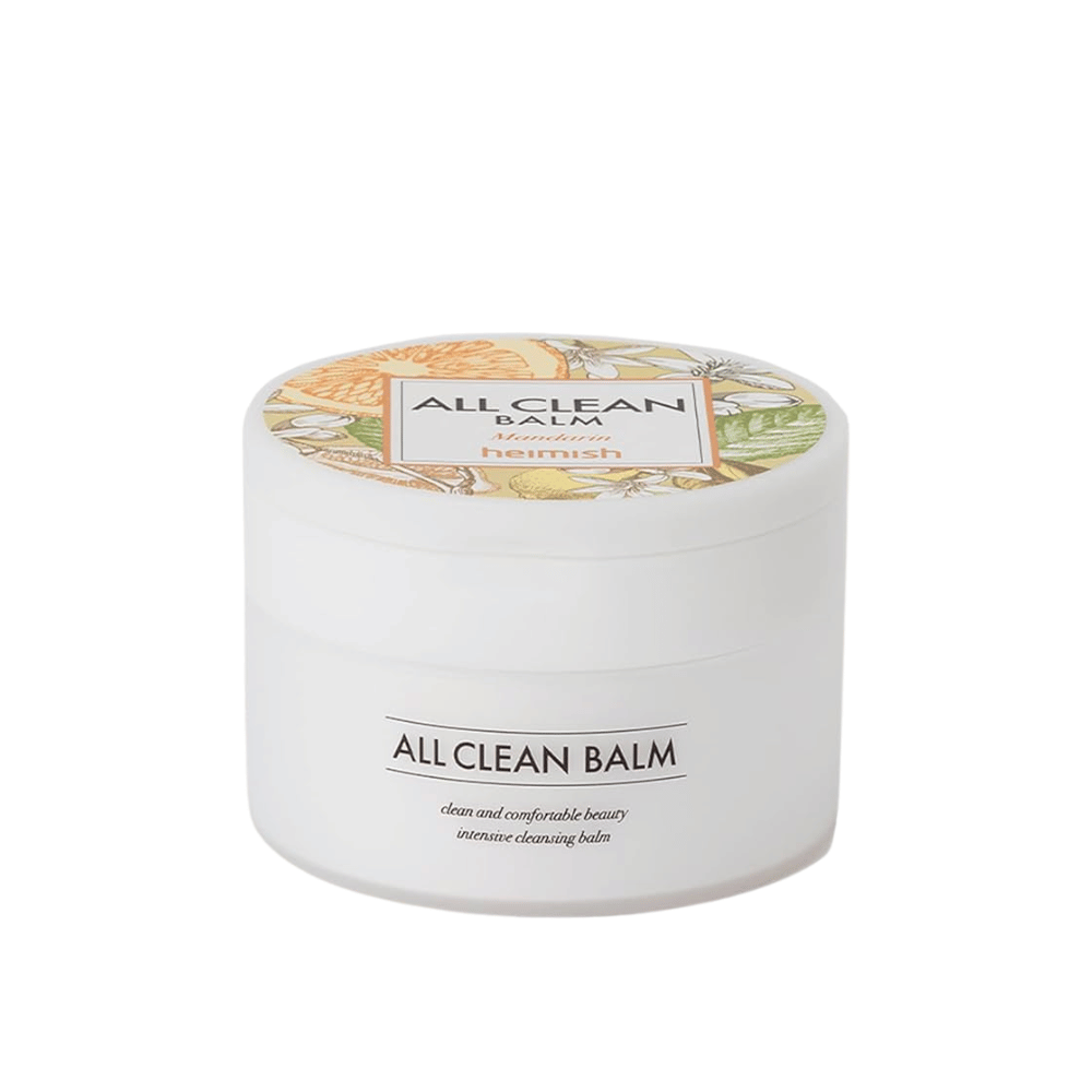 En dåse af Heimish All Clean Balm med mandarin-duft, en intensiv rensebalm, med en farverig etiket og hvid emballage.