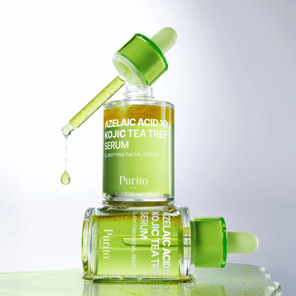 Purito Azelaic Acid 10 Kojic Tea Tree Serum – frisk grøn formel med dråbe fra pipette, der viser serumets lette tekstur.