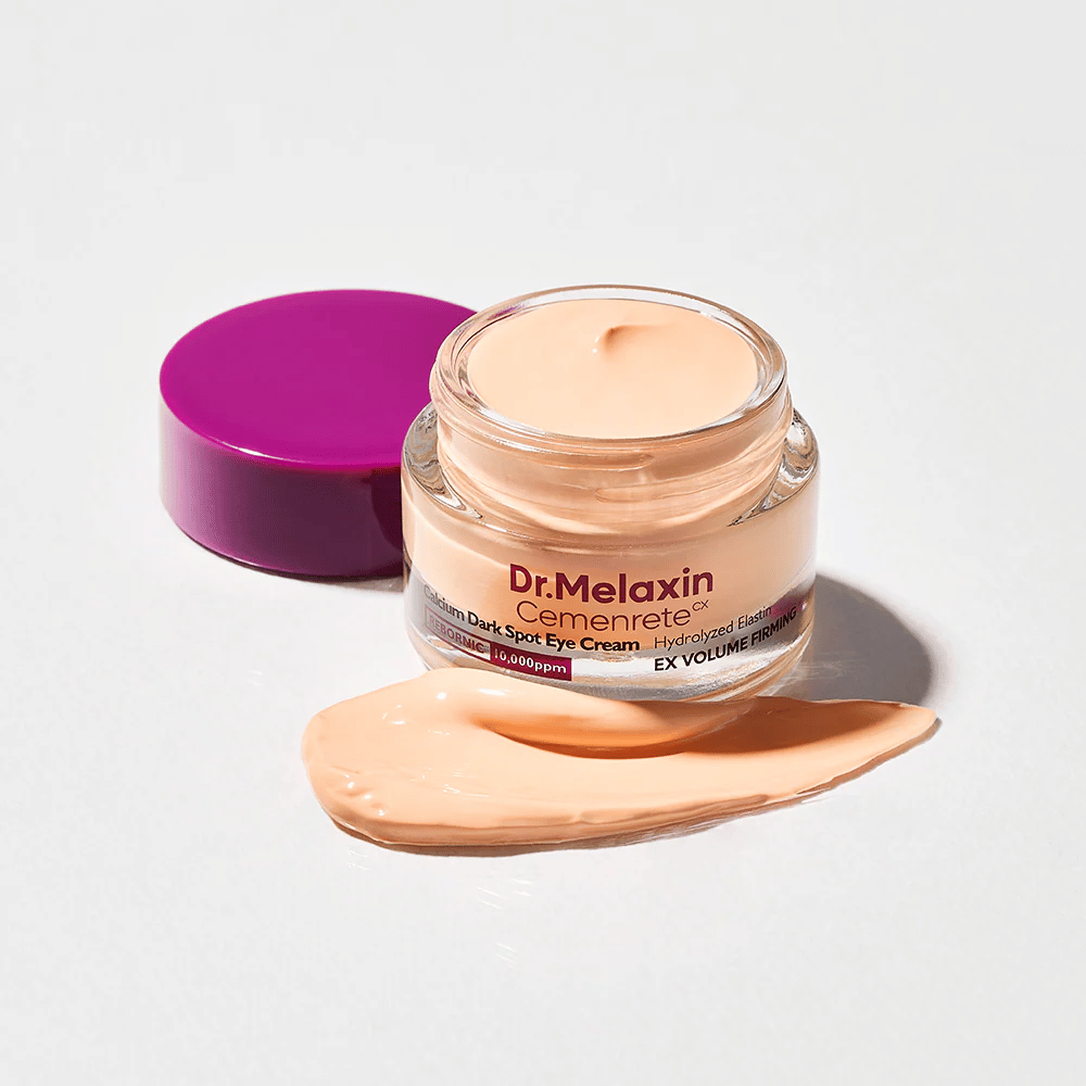 Dr.Melaxin Cemenrete Calcium Dark Spot Eye Cream i åben krukke med creme tekstur, øjencreme der hjælper med at reducere mørke rande og give fastere hud omkring øjnene.