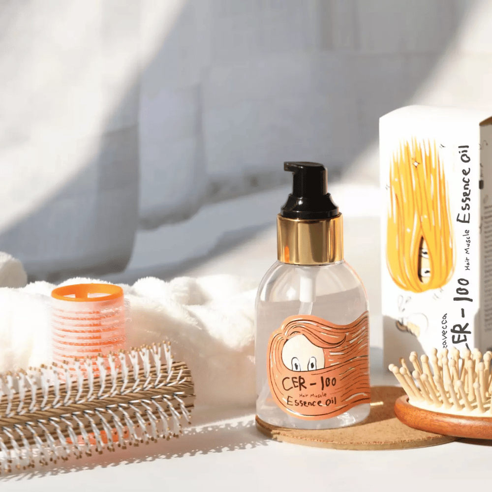 Elizavecca CER-100 Hair Muscle Essence Oil styling – fugtgivende hårolie, der hjælper med at reducere krus, give glans og beskytte håret ved styling.