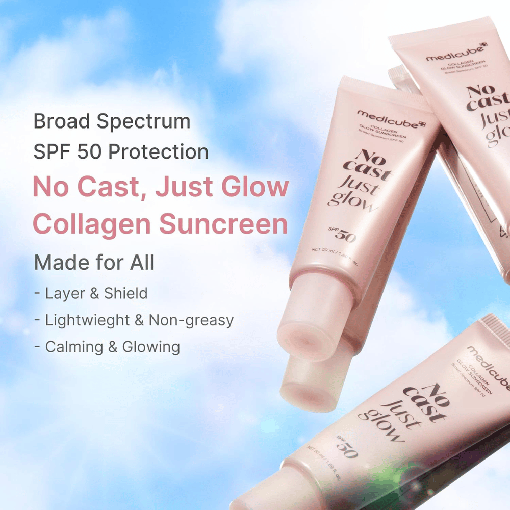 Medicube Collagen Glow Sunscreen SPF 50, let solbeskyttelse med glow-effekt uden hvid hinde. Lyserøde solbeskyttelsestuber mod en blå himmel.