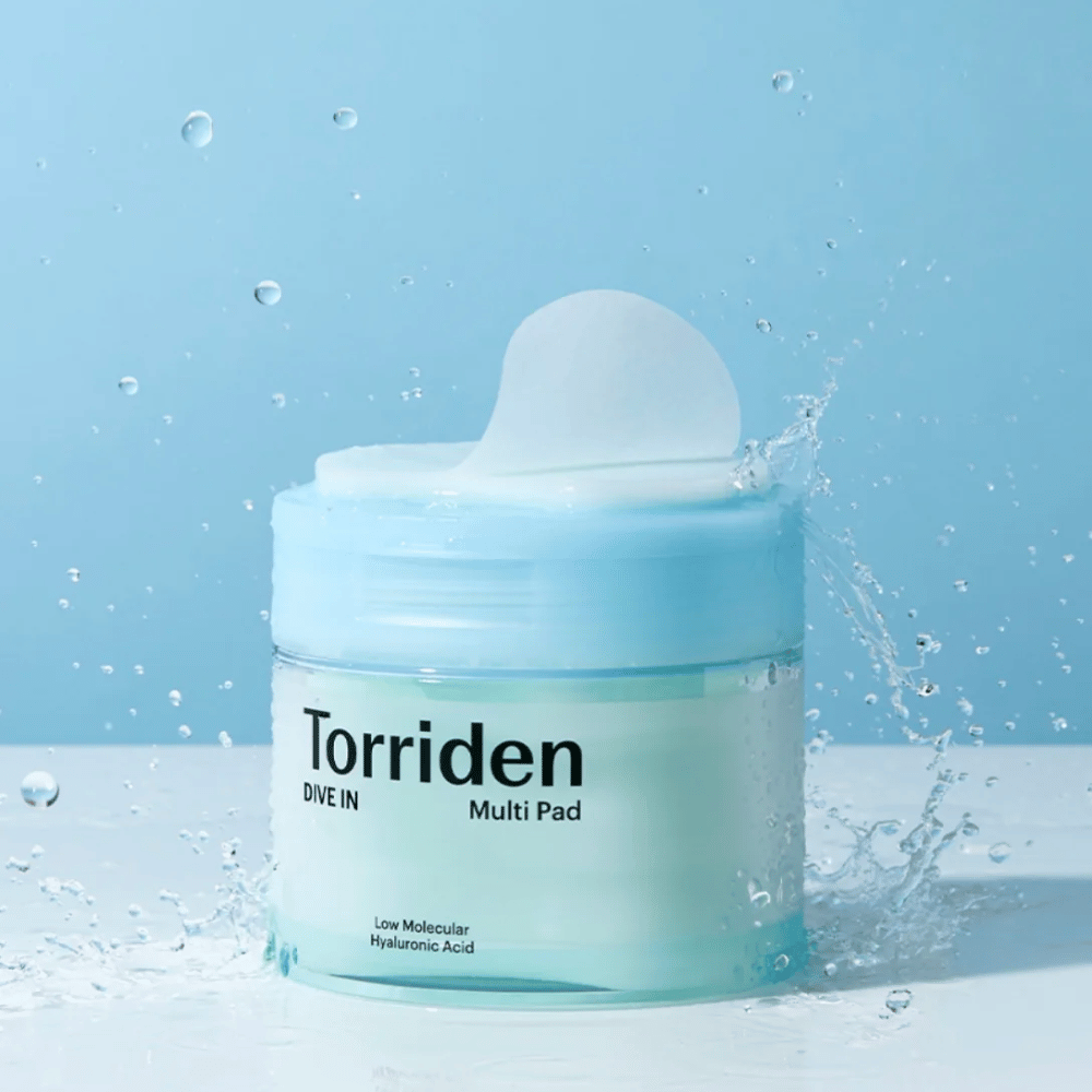 Torriden "DIVE IN Multi Pad" med vanddråber i luften mod blå baggrund.