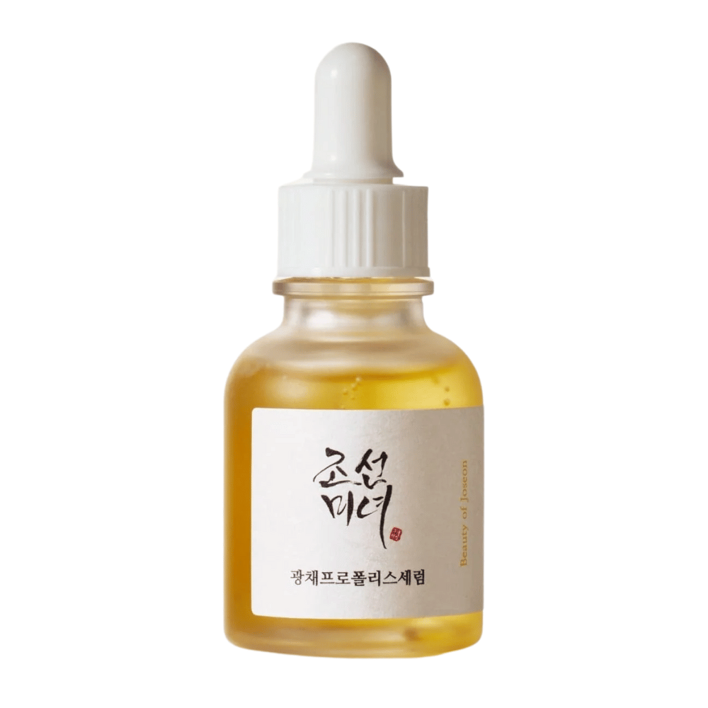 Flaske af Beauty of Joseon Glow Serum med hvid pipette og guldfarvet serum, et glødgivende produkt med propolis og niacinamid.