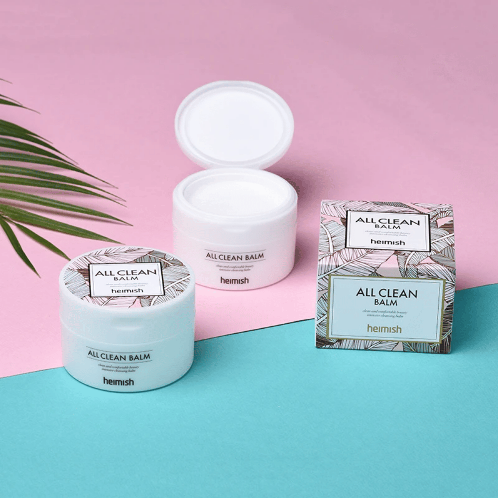 Heimish All Clean Balm 120ml og en palme på rosa og blå baggrund, velegnet til sensitiv hud.