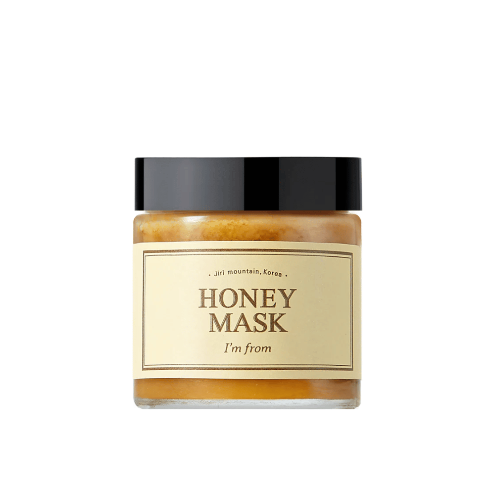  En krukke "I'm from Honey Mask", med naturligt honningindhold, mod hvid baggrund.