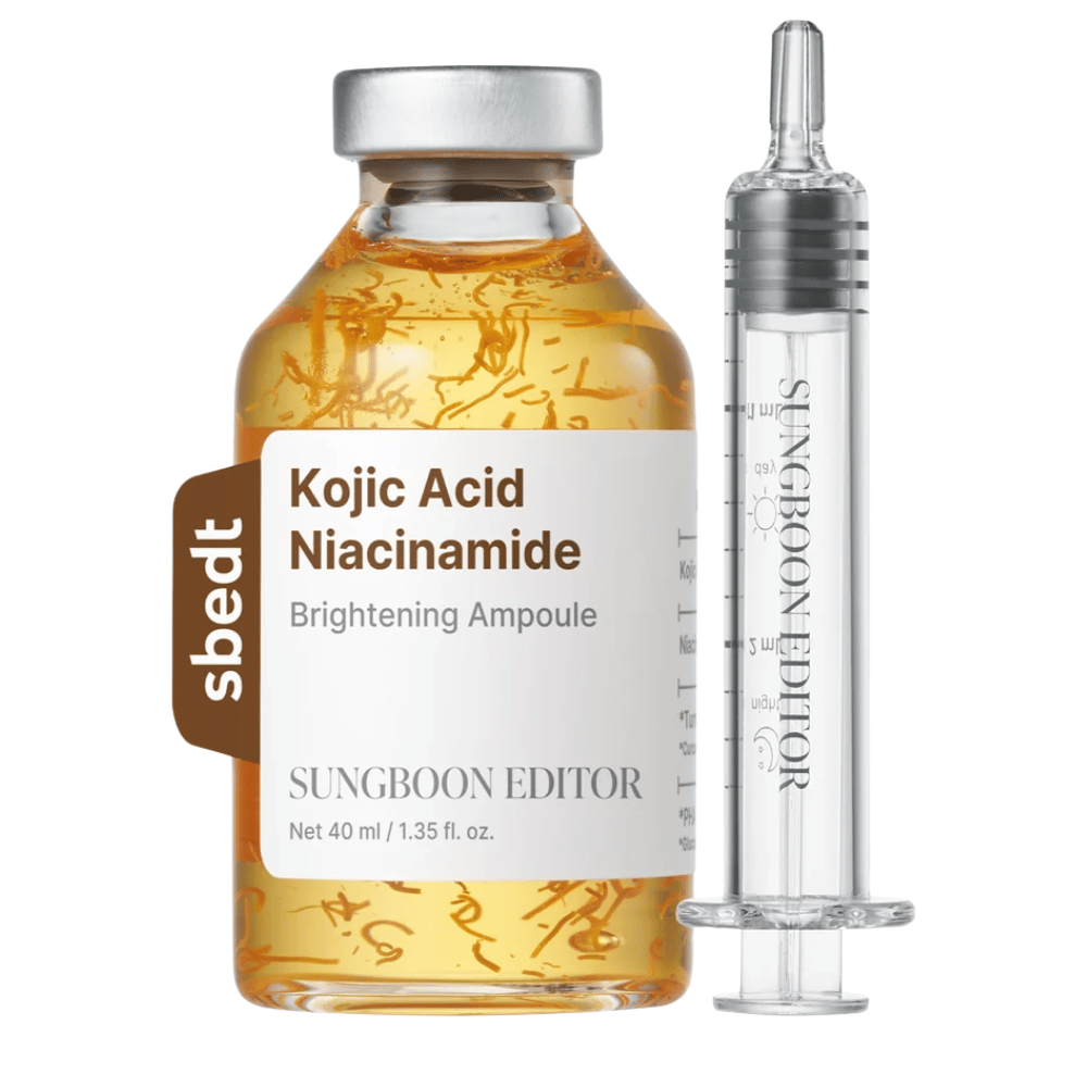 7. SUNGBOON EDITOR Kojic Acid Niacinamide Brightening Ampoule 40 ml – gylden serumflaske med synlige aktive tråde og transparent applikator mod hvid baggrund