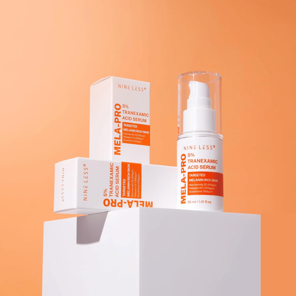 NINE LESS MELA-PRO 5% Tranexamic Acid Serum 30 ml med emballage, glødgivende serum mod pigmentpletter og ujævn hudtone.