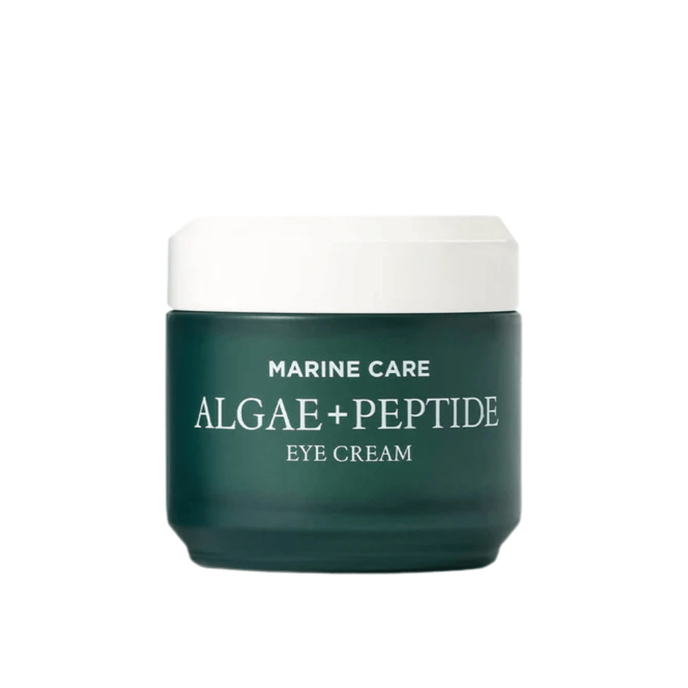 Heimish Marine Care Algae + Peptide Eye Cream i en mørkegrøn dåse med hvidt låg. En øjencreme beriget med alger og peptider for at fugte, lysne op og reducere fine linjer omkring øjnene.