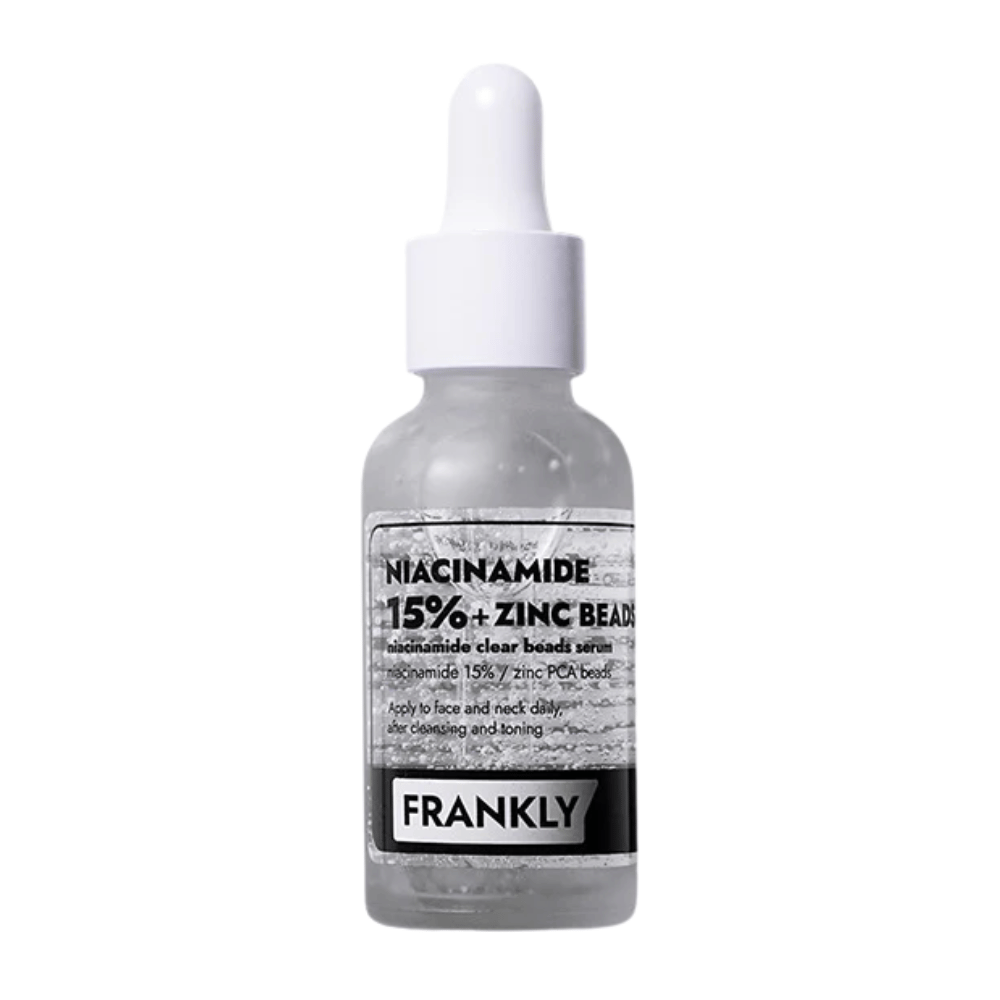 Produktbillede af FRANKLY Niacinamide 15% + Zinc Beads Serum i glasflaske med pipette. Et serum der balancerer, beroliger og forbedrer hudens klarhed.