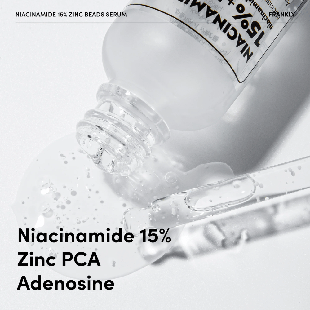 Nærbillede af FRANKLY Niacinamide 15% + Zinc Beads Serum der hældes ud. Tekst viser ingredienser: Niacinamide 15 %, Zinc PCA og Adenosine.