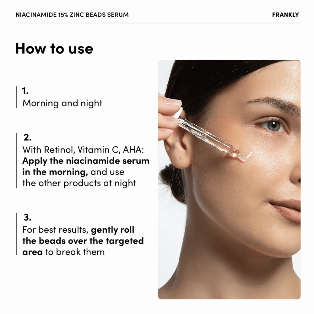 Kvinde påfører FRANKLY Niacinamide 15% + Zinc Beads Serum med pipette på kind. Tekst forklarer brug morgen og aften samt forsigtig massage af perler.