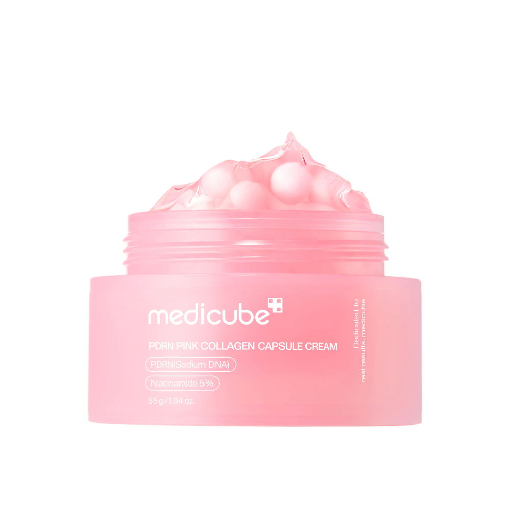 Produktbillede af Medicube PDRN Pink Collagen Capsule Cream med synlige lyserøde kapsler i en transparent lyserød krukke, designet til at fugte og udjævne hudtonen.