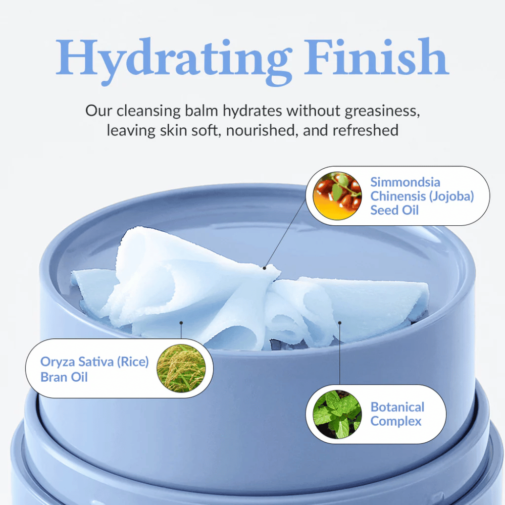 Dr.Althea Pore Refresh Grinding Cleansing Balm med teksten "Hydrating Finish" ovenfor. Produktet indeholder Simmondsia Chinensis (Jojoba) Seed Oil, Oryza Sativa (Rice) Bran Oil, og et botanisk kompleks. Cremen giver en fugtgivende effekt uden at føles fedtet, hvilket efterlader huden blød, næret og frisk.