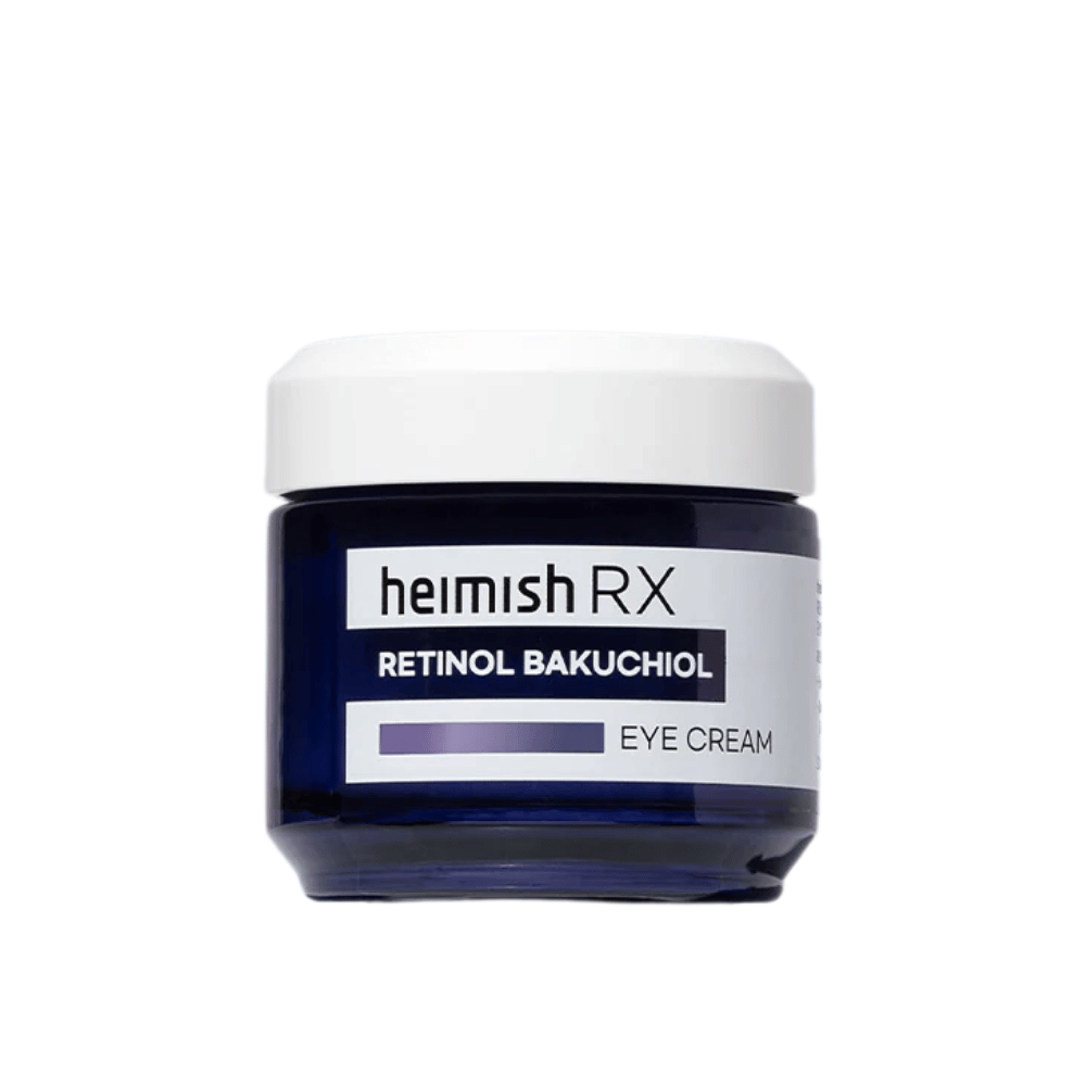 Heimish RX Retinol Bakuchiol Eye Cream i en mørkeblå krukke med hvidt låg. En øjencreme beriget med retinol og bakuchiol for en glattere og fastere hud omkring øjnene.