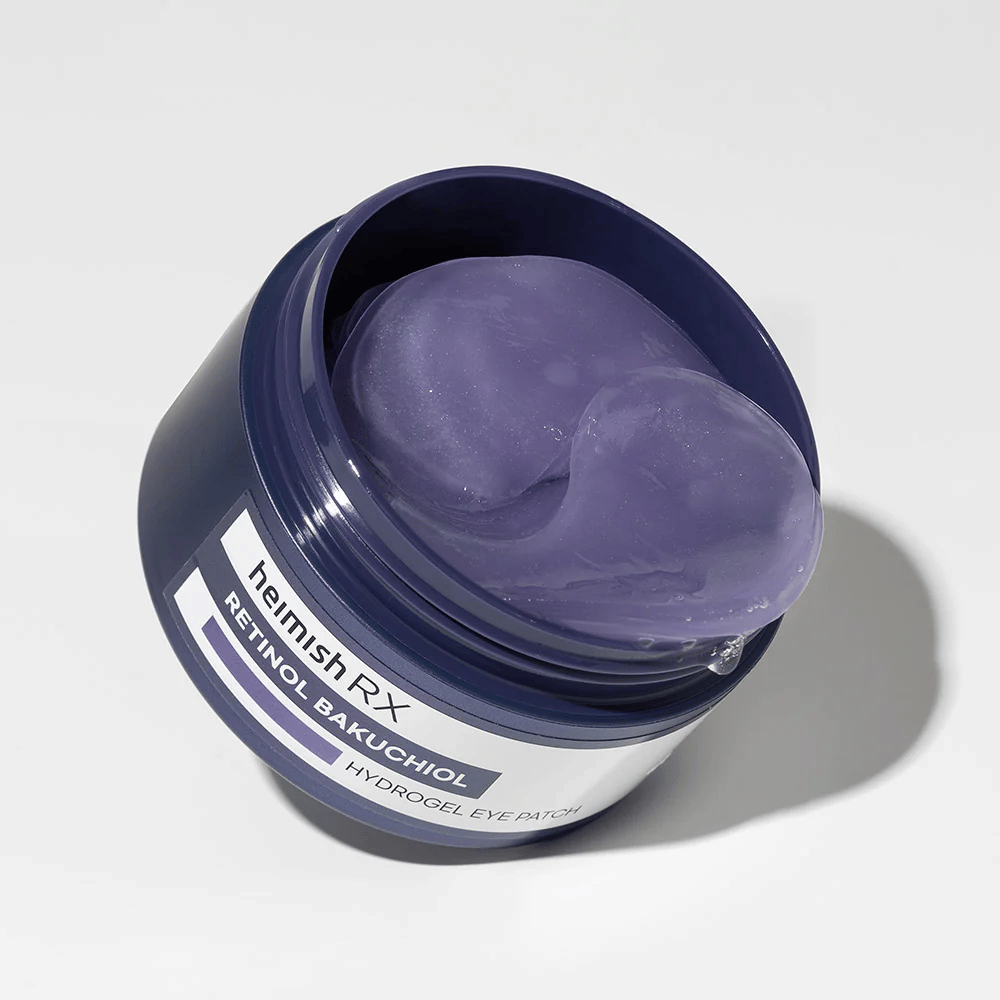 Heimish RX Retinol Bakuchiol Hydrogel Eye Patch i en mørkeblå dåse med lilla hydrogel-øjenlapper. Et produkt designet til at fugte og reducere fine linjer omkring øjnene.