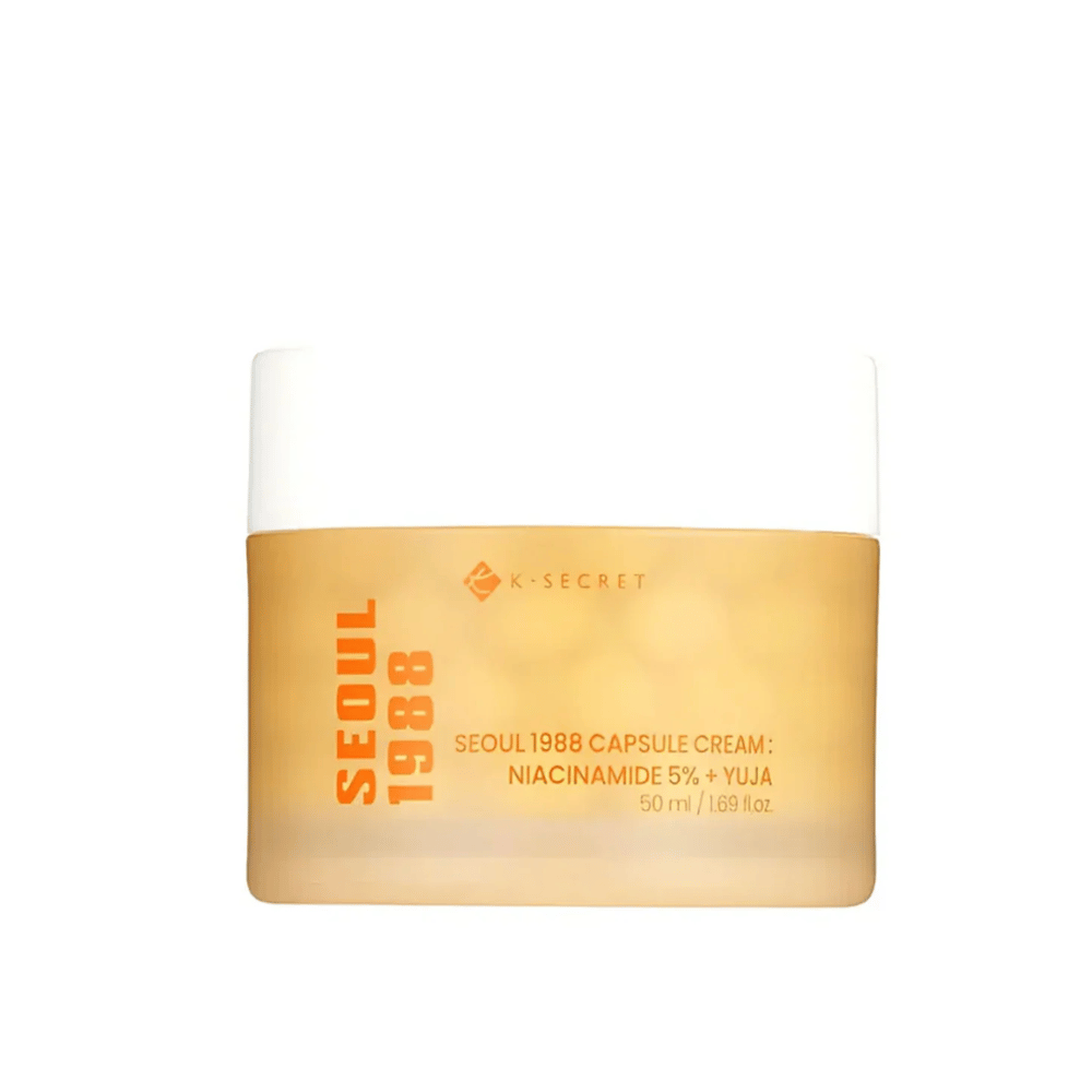 Krukke med K-Secret Seoul 1988 Capsule Cream Niacinamide 5% + Yuja, 50 ml, i guldfarvet designet emballage.