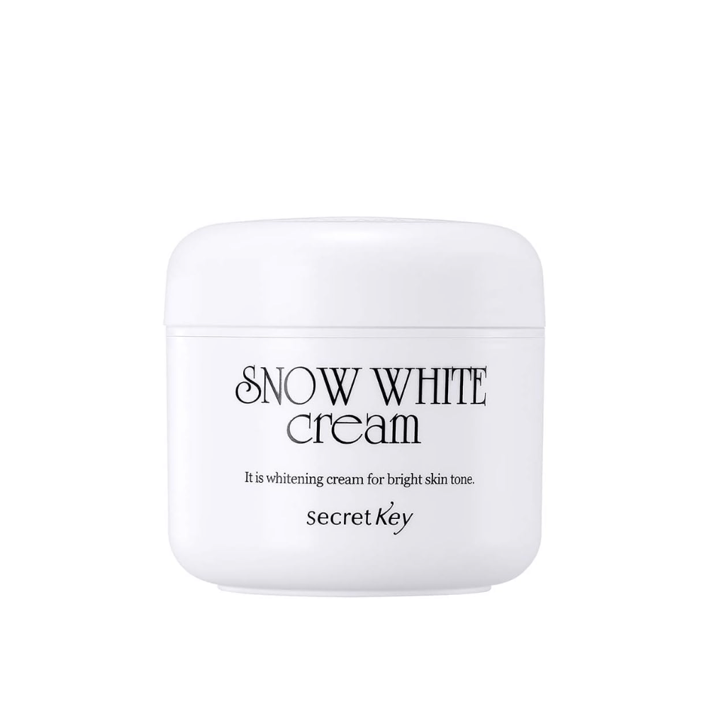 Produktbillede af Secret Key Snow White Cream i hvid krukke med sort tekst mod hvid baggrund.