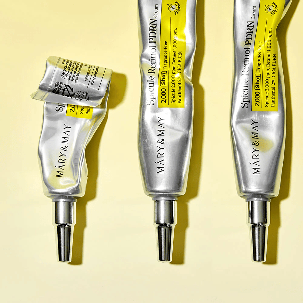 MARY & MAY Spicule Retinol PDRN Cream med synlig brug i tube, viser cremens konsistens og målrettet applikator til præcis påføring på huden.
