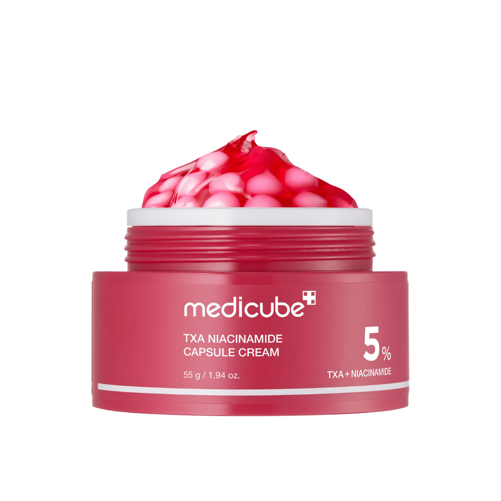 Medicube TXA Niacinamide Capsule Cream i krukke med lyserøde kapsler i geléform, viser tydelig produktmærkning med 5 % TXA + Niacinamid.