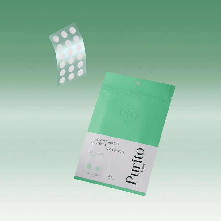 Purito Wonder Releaf Centella Spot Patch med emballage og gennemsigtige acneplastre, beroligende spot treatment med centella asiatica til bumser og irriteret hud.